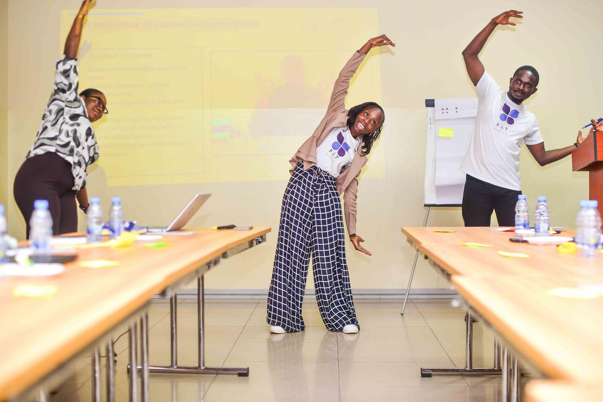 Team members taking a stretch break during a workshop